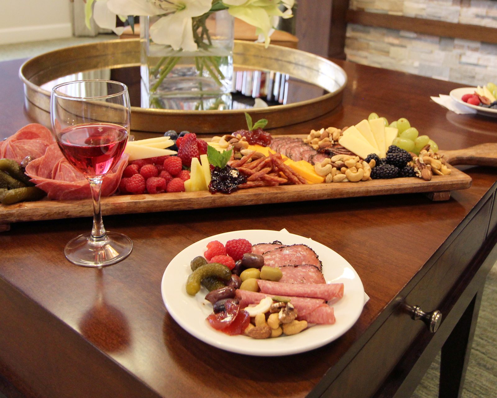 A shared charcuterie board with wine at Evolve at Lake Zurich