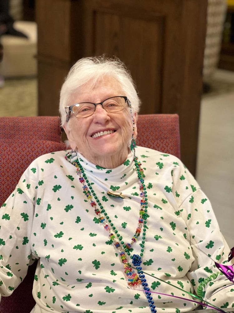 Resident smiling during a community celebration