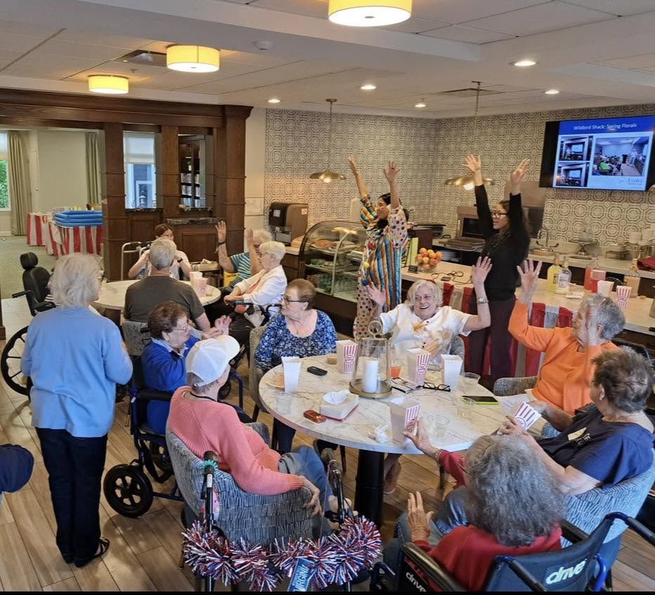 Residents celebrating together in the dining room
